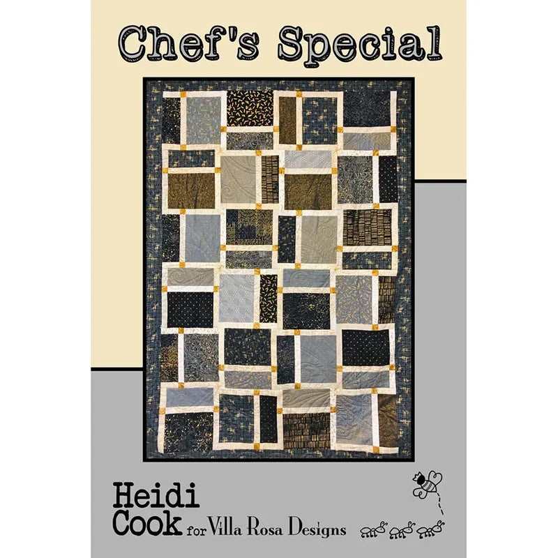 Quilt with dark navy, cream, and gold patchwork blocks