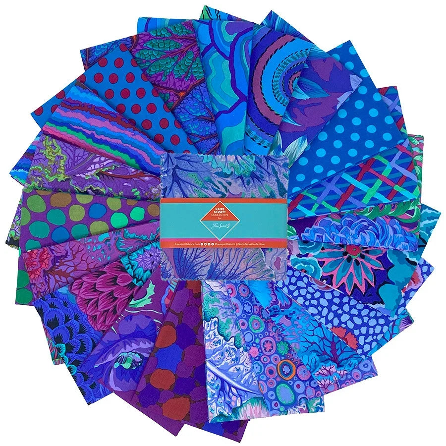 Quilt fabric charm pack with mixed blue, purple, green prints squares