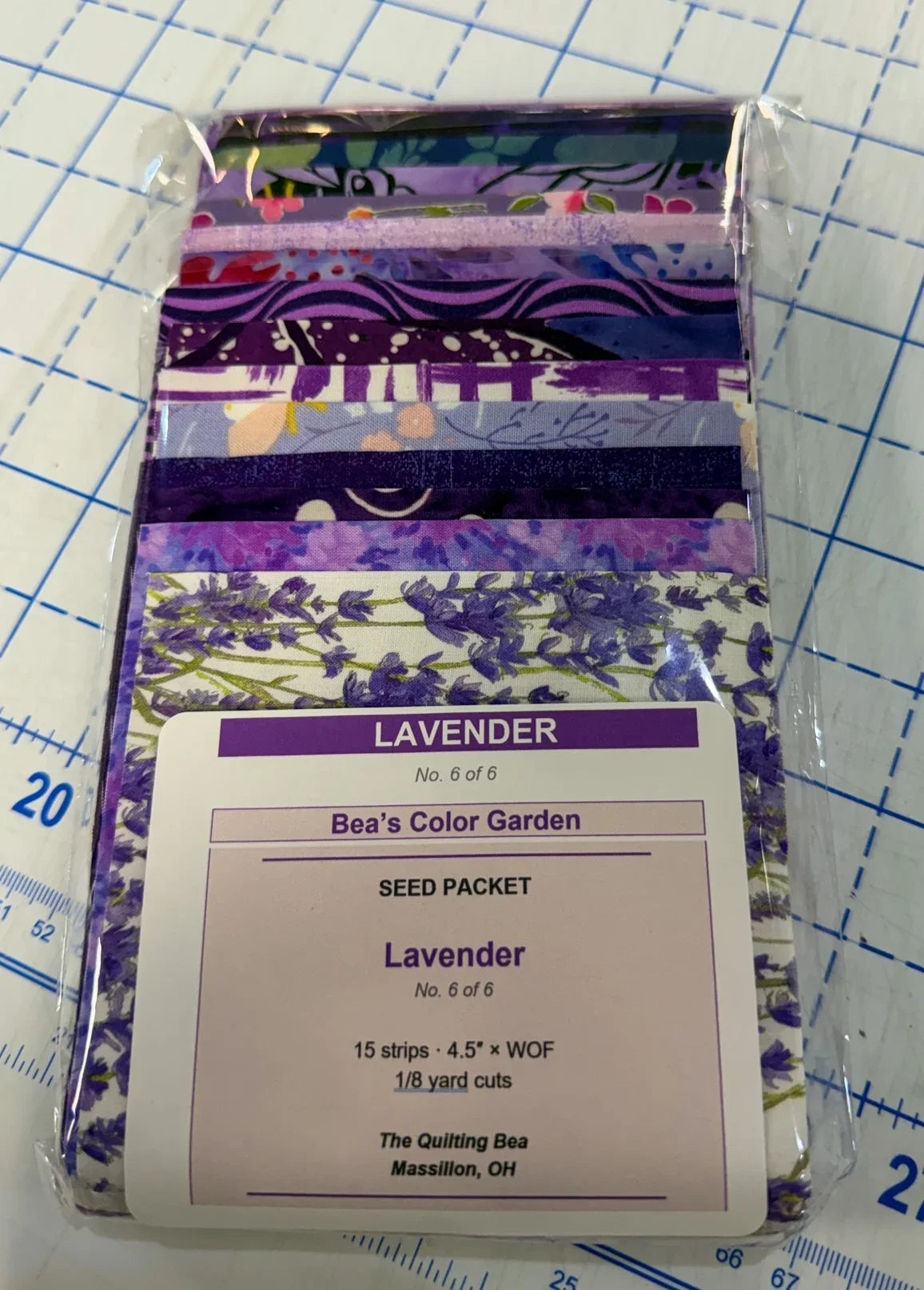 Lavender seed packet with label and sealed purple patterned fabric stack