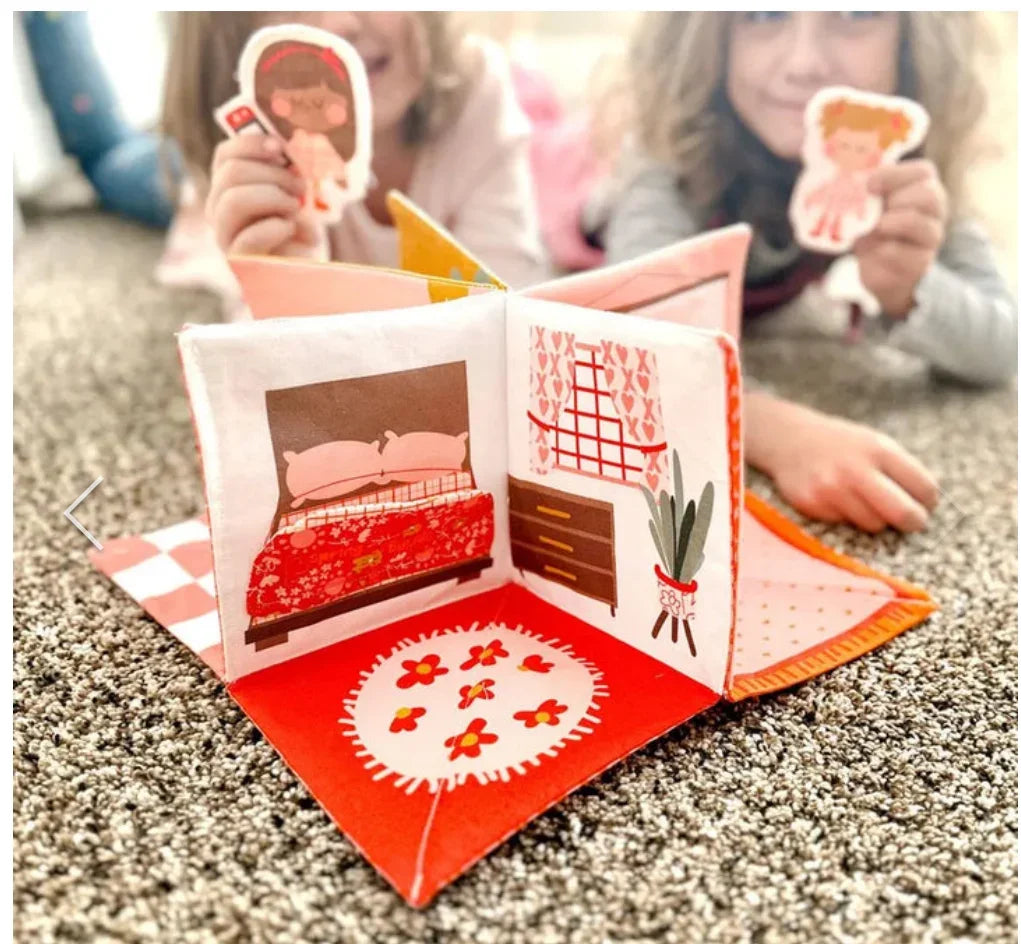 Felt dollhouse book with open room scene, red bedding and window panel