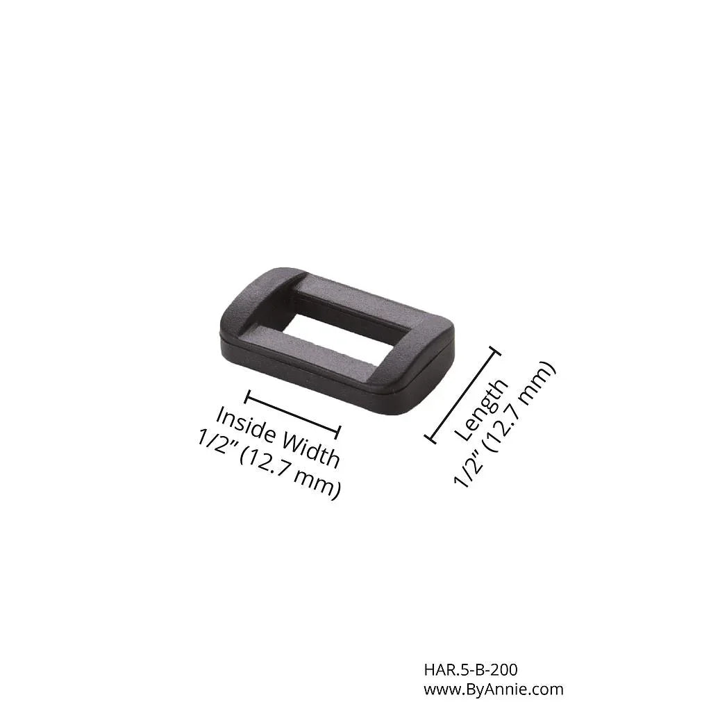 Black plastic rectangle ring, 1/2" inside width, 1 1/2" length.