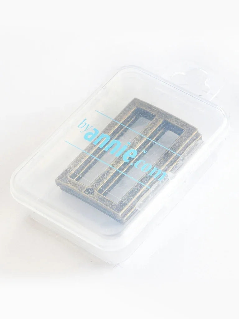 Slider set, two rectangular pieces in clear plastic case with blue-gray finish