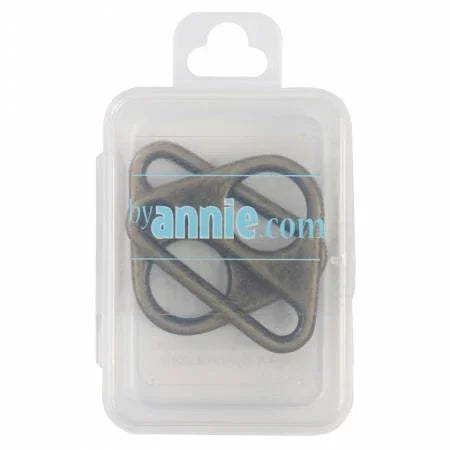 Antique brass triangle flat rings, set of two, shown in clear blister package.