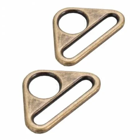 Two flat triangle rings in antique brass, with oval cutout and diagonal bar
