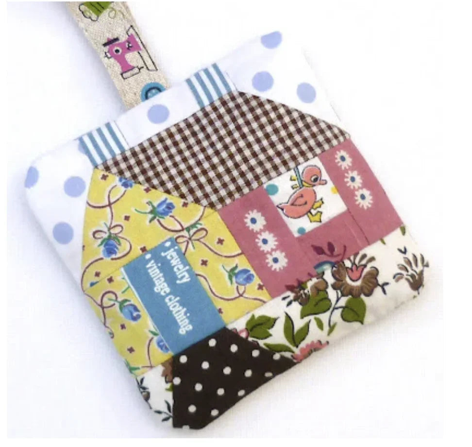 Patchwork fabric quilt block with bright cartoon and gingham patches