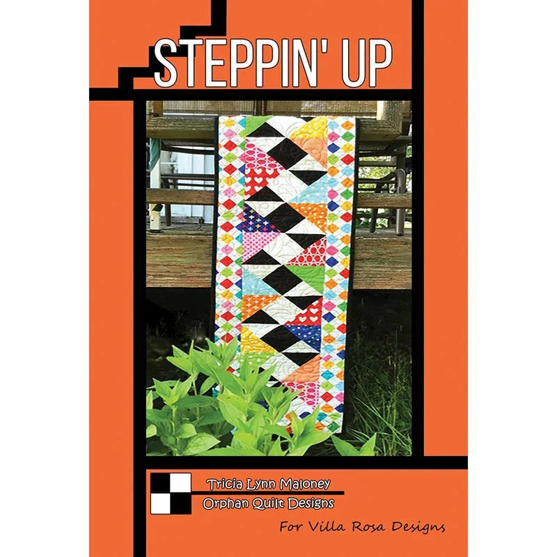Steppin' Up quilt pattern cover featuring colorful patchwork quilt with black-and-white blocks.