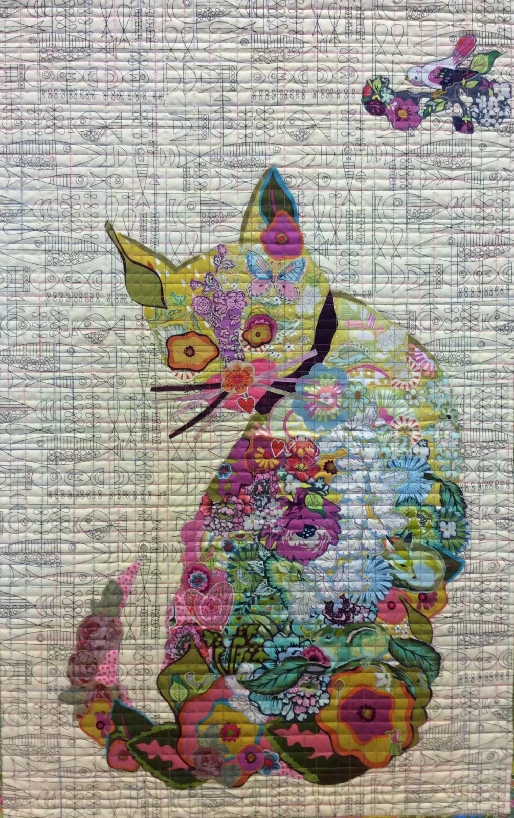 Quilted fabric with multicolor owl collage pattern