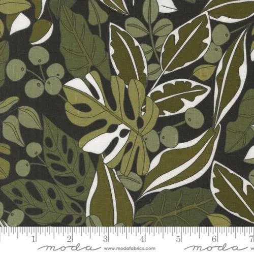 Botanical leaf print fabric with dark green, olive, and white foliage pattern