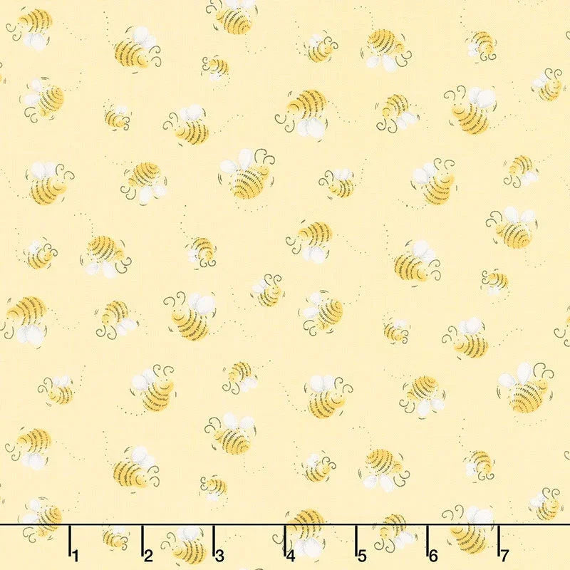Bees print quilting fabric, light yellow with small yellow and white bee motifs