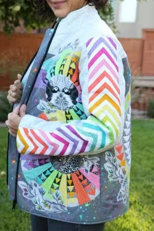 Quilted coat with multicolor chevron accent sleeves and patterned arm panel