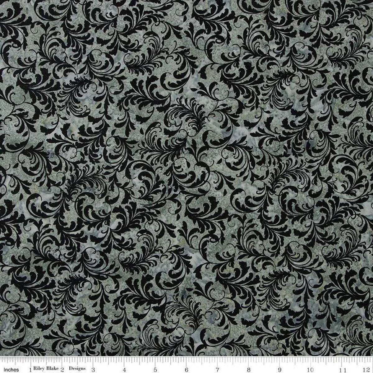 Batik fabric swatch with dark gray and black swirling vine pattern