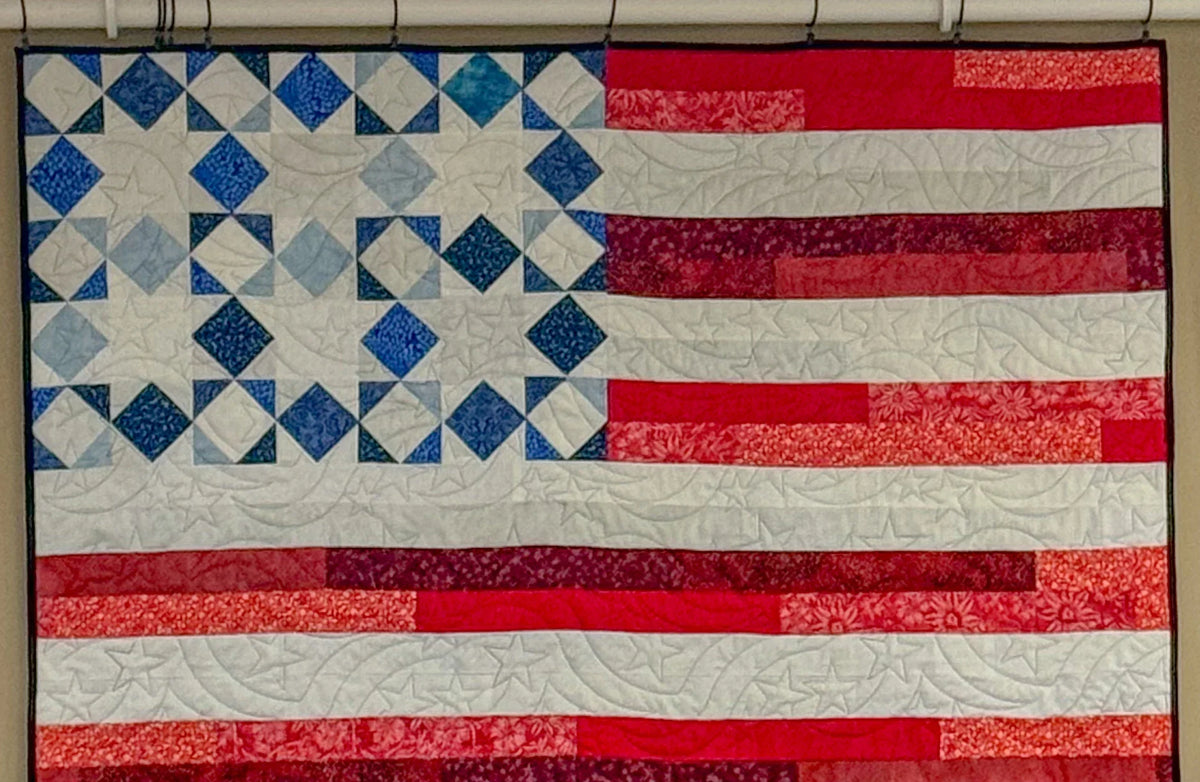 Liberty Flag quilt top with blue diamond stars and red-and-white striped rows