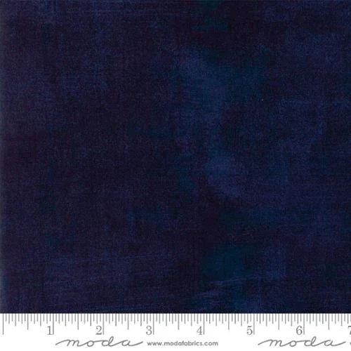 Dark blue peacoat fabric swatch with textured, grunge-like surface