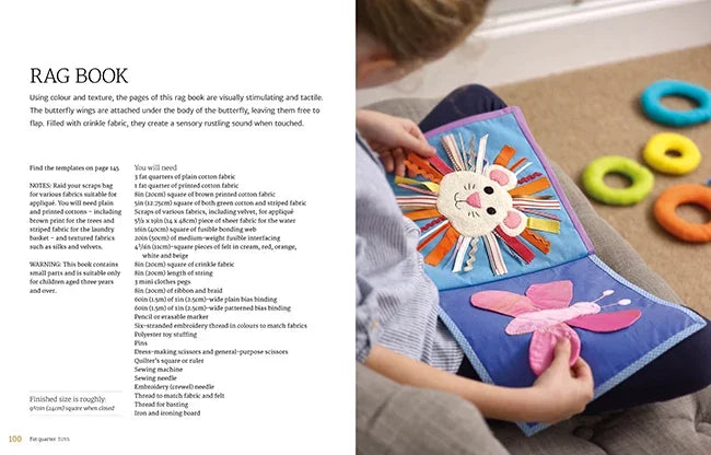 Open fabric craft book with RAG BOOK instructions and a handmade fabric play piece
