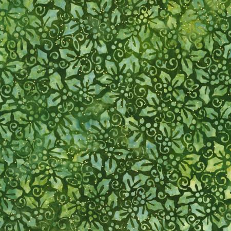 Green batik fabric with floral and swirl motifs, textured surface