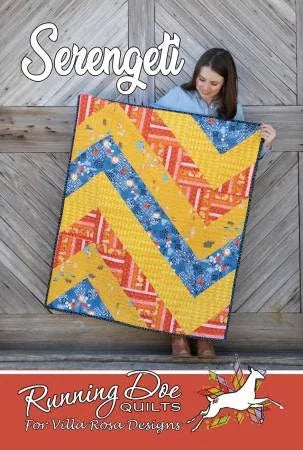 Colorful patchwork quilt with chevron stripes in yellow, blue, and red