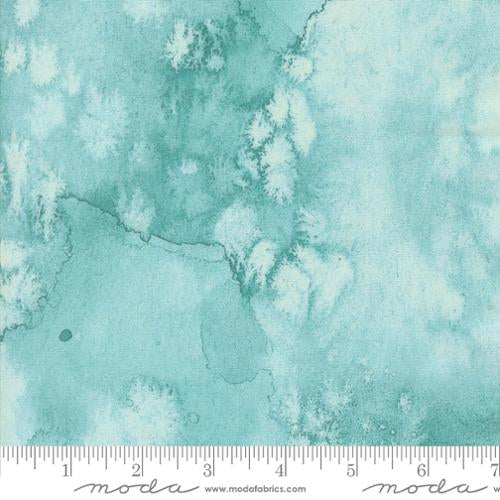 Teal cotton quilting fabric with white floral and cloud-like abstract pattern