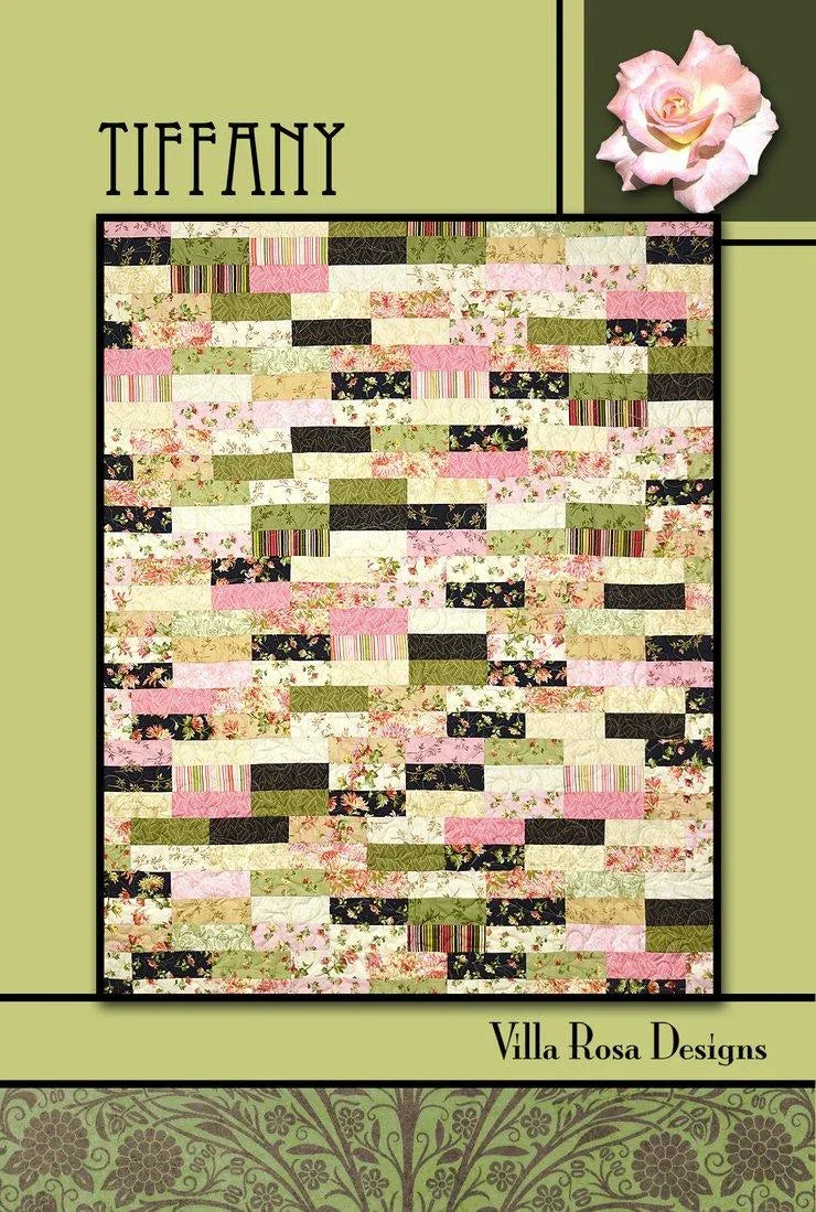 Quilt pattern design featuring pink, green, and black patchwork blocks