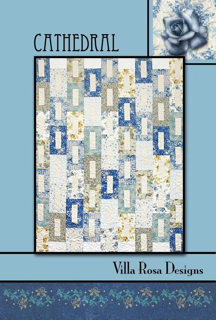 Cathedral quilt pattern with blue, white, and tan geometric blocks on a full quilt layout