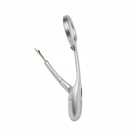 Silver seam ripper with magnifier lens and metal tip, overhead angled view
