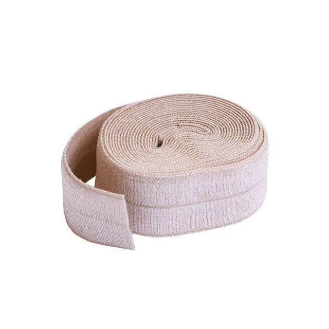 Fold-over elastic tape, natural tan, rolled spool
