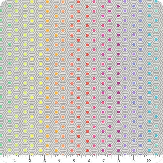 Hexagon print quilting fabric with multicolor pastel pattern on light background