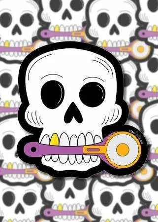 Skull sticker with rotary cutter design, white skull face with black eyes and yellow accents