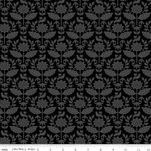 Black wallpaper with repeating gray floral medallions and leaf vines pattern