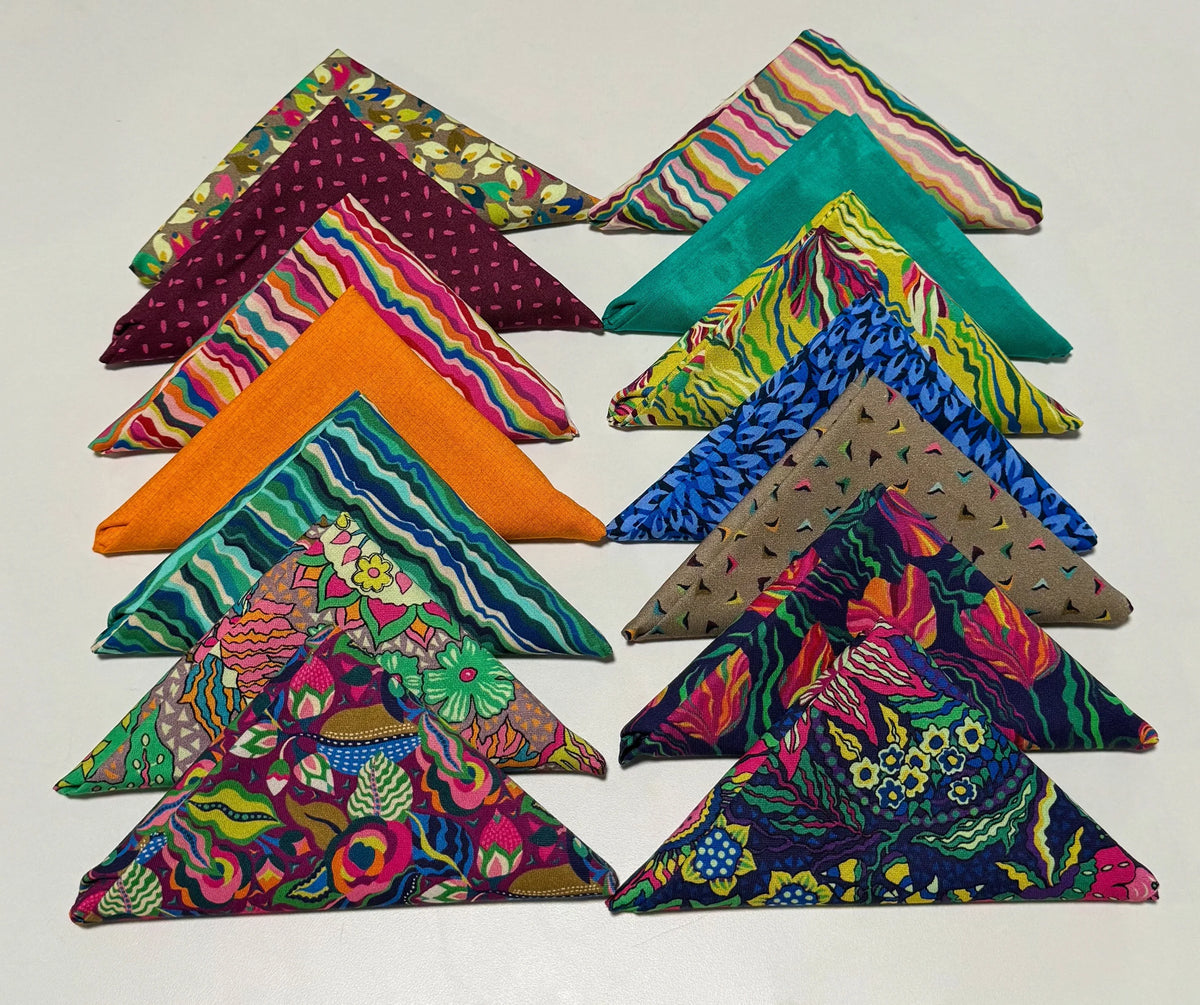 Colorful patterned fabric fat quarter bundle, folded triangles in green, teal, purple, orange