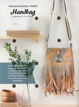 Fringed diagonal striped cork handbag with crossbody strap and round metal button accents