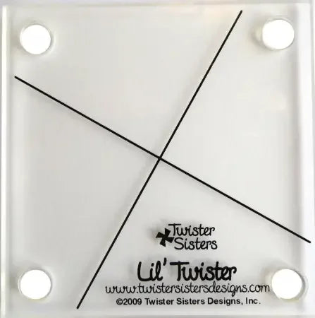 Lil' Twister pinwheel cutting tool with cross-slotted blade guide on white backing
