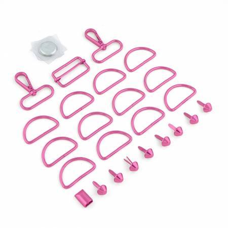 Assorted pink tote hardware pieces with D-rings, sliders, and loop fasteners