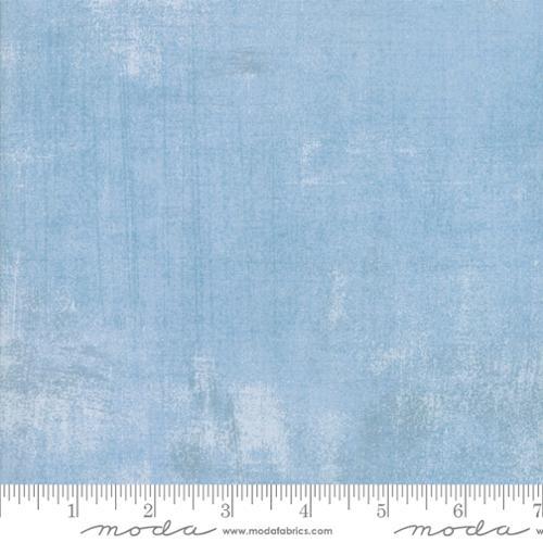 Cotton quilting fabric, light blue with subtle grunge cosmic texture
