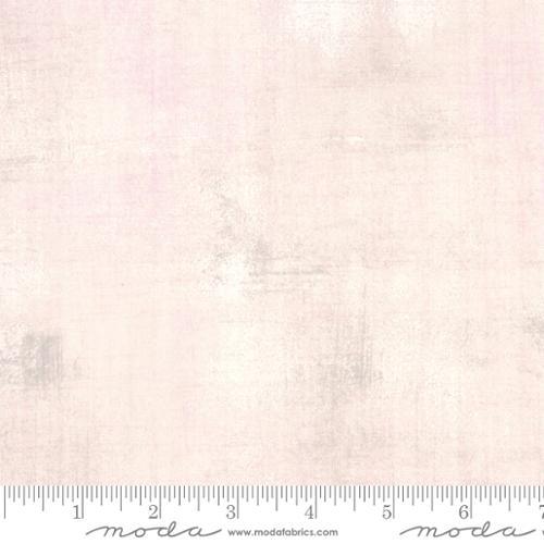 Light beige ballet slipper print fabric yardage with straight edge and measuring scale