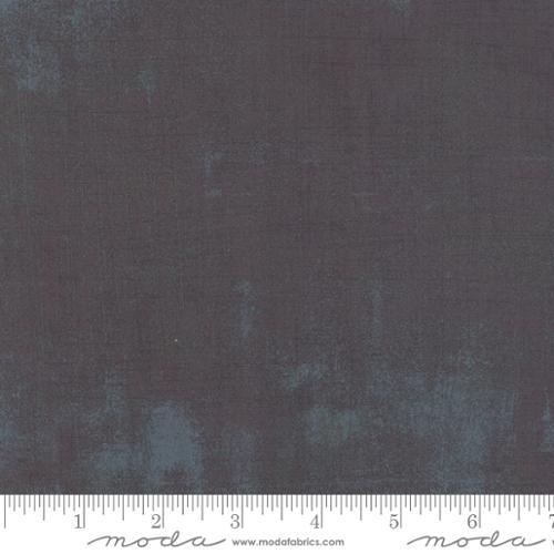 Textured fabric swatch in dark gray-blue with subtle speckled pattern