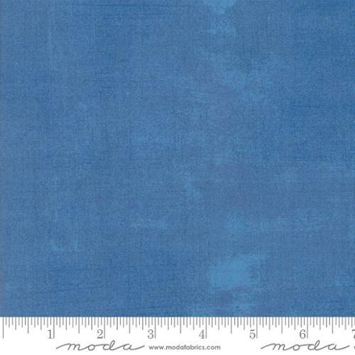 Blue grunge-style quilting fabric swatch with textured surface