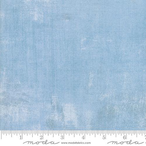 Blue grunge texture quilting fabric with mottled, weathered finish