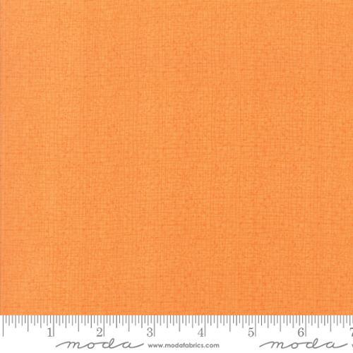 Apricot textured cotton fabric swatch with subtle crosshatch pattern