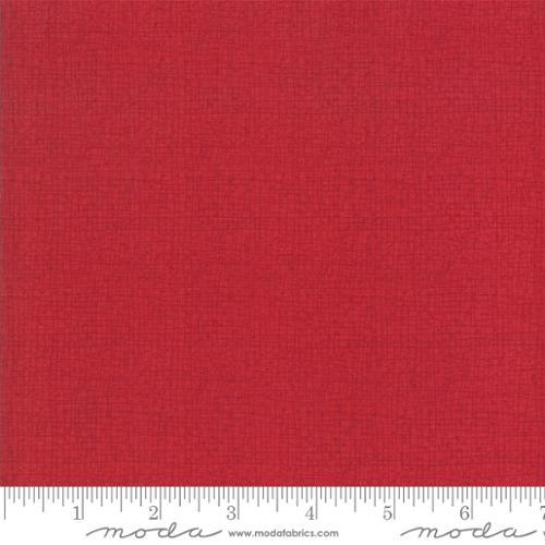 Red woven fabric swatch with subtle texture