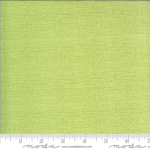 Green textured woven fabric with subtle slub pattern, Moda Fabrics
