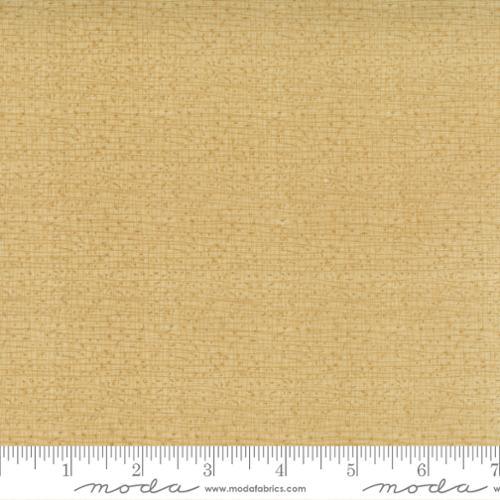 Textured cotton fabric swatch with light tan woven pattern