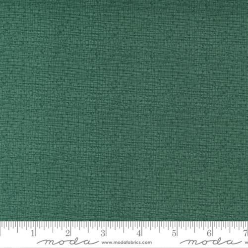 Green woven cotton fabric with subtle thatched texture, Moda Fabrics swatch