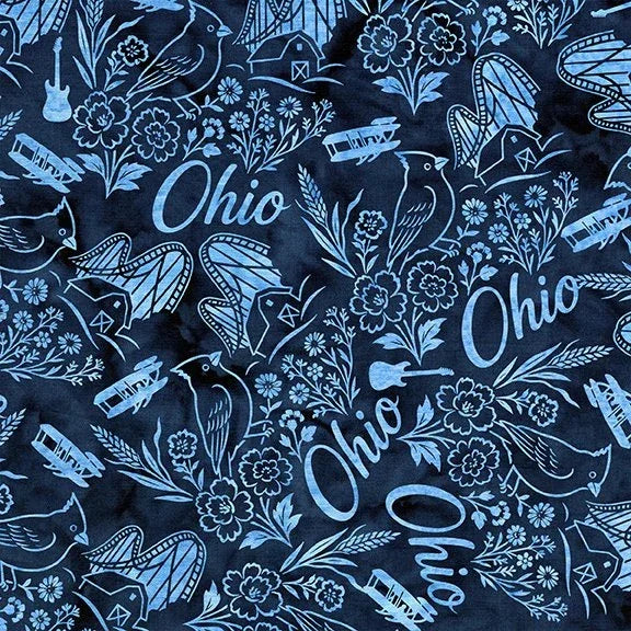 Quilt fabric in dark navy with light blue Ohio script, birds, flowers, and ring symbols