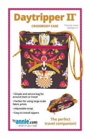 Colorful patterned crossbody case with adjustable strap and zip closure