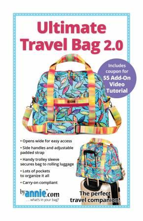 Colorful quilted-style travel bag with top handles and adjustable shoulder strap.