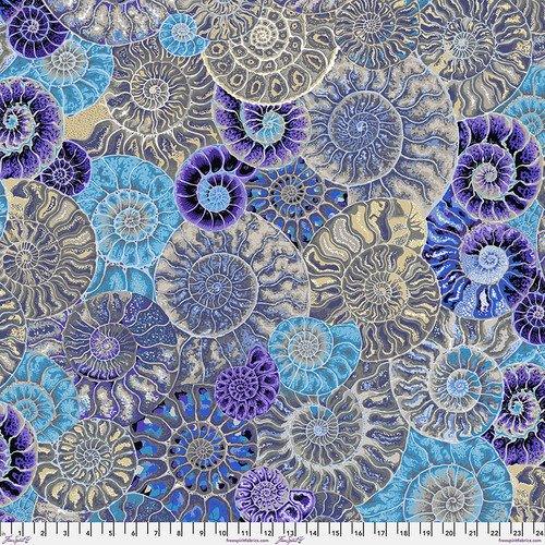 Ammonite print fabric with blue, purple, and tan seashell-style motifs, woven texture