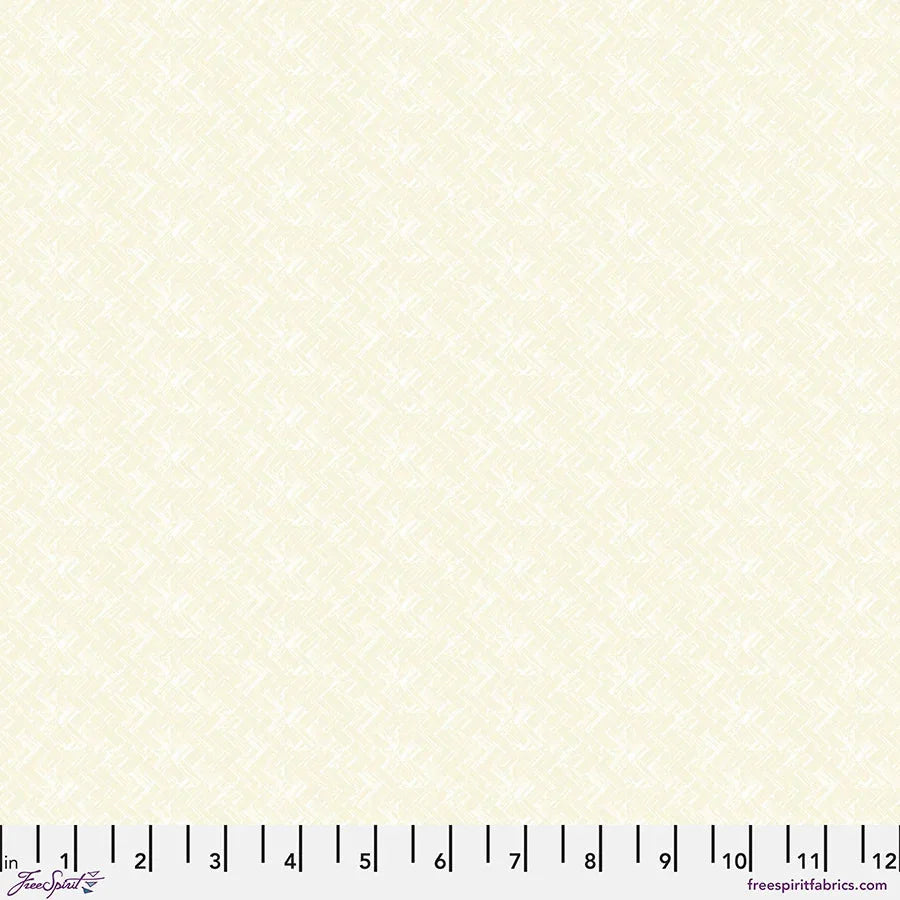 Fabric swatch with small geometric dot pattern on light cream background