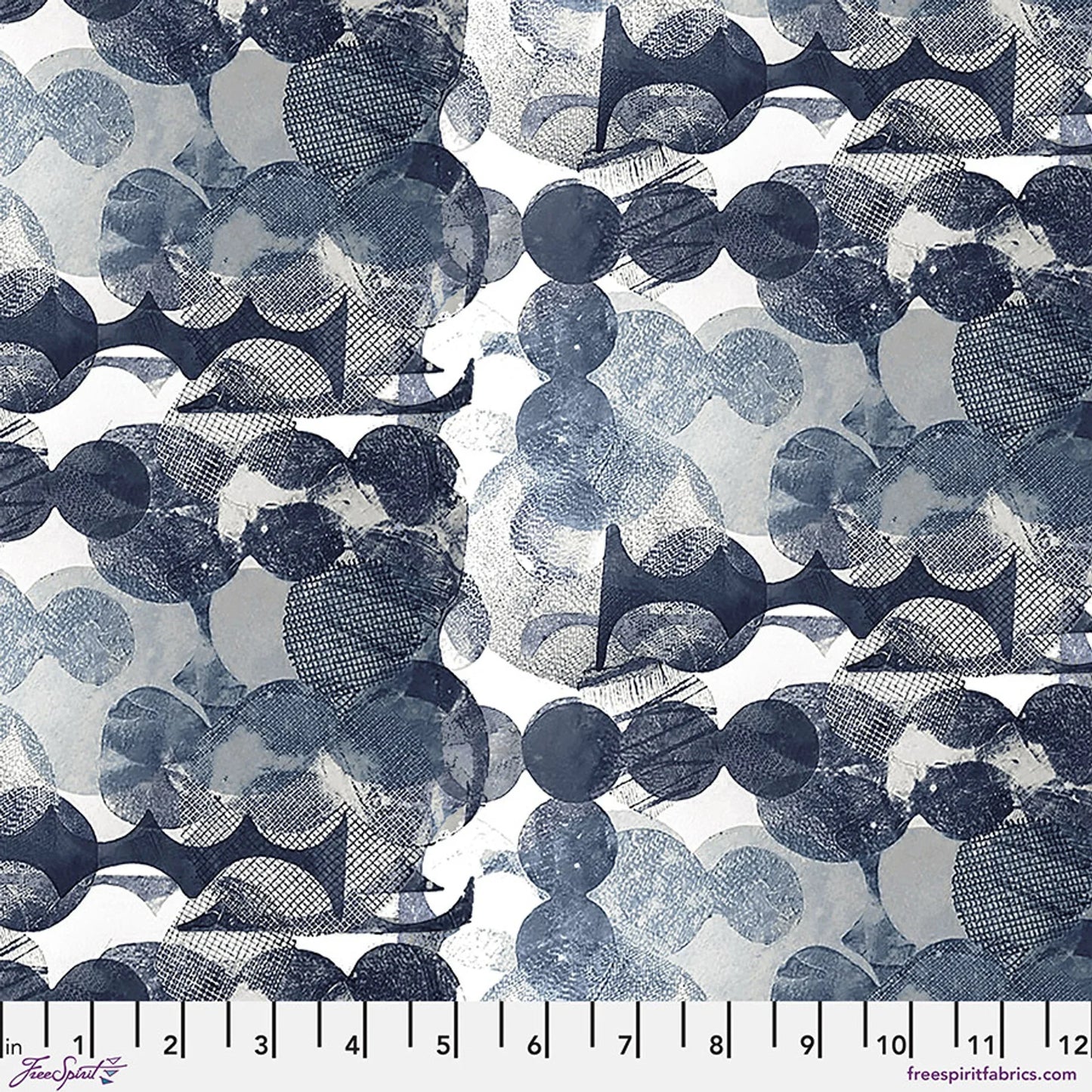 Blue and navy moon pattern fabric with scattered star-like shapes