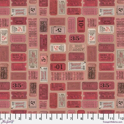 Red fabric swatch with ticket-style patchwork print and small text details