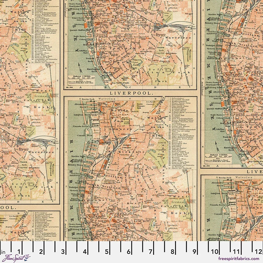 Map print quilting fabric in orange, beige, and green tones